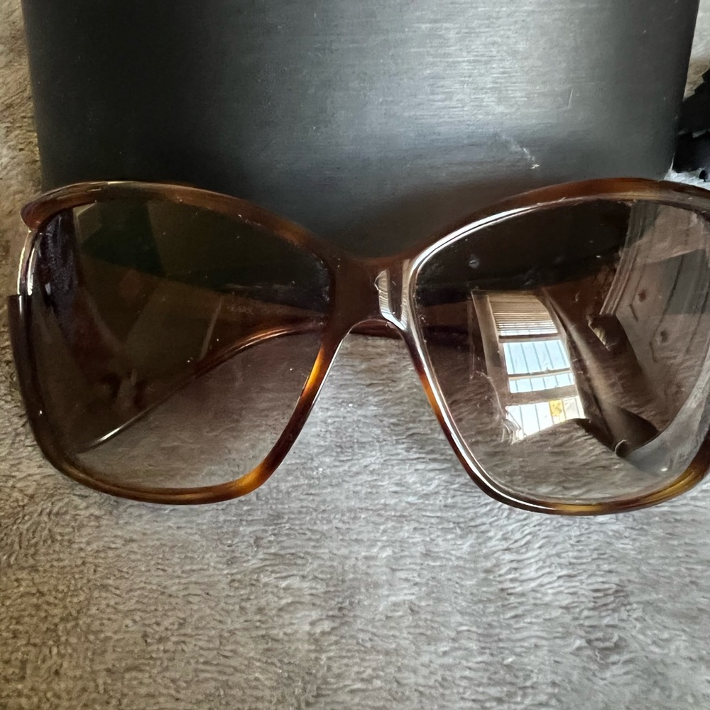 Oliver Peoples sunglasses.